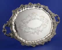 A 20th century Spanish silver oval two handled tea tray, with engraved decoration and foliate scroll