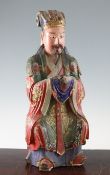 A Chinese polychrome carved figure of a seated official, late 19th / early 20th century, with faux