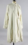 A cream silk desert robe belonging to T.E. `Lawrence of Arabia,` c.1916, of simple form with silk