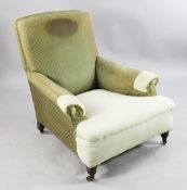 A late Victorian Howard & Sons easy armchair, with out-scrolled arms, on ring turned supports with