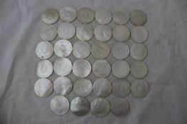 A collection of ninety three 19th century Chinese mother of pearl gaming counters, each with