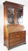 A George III mahogany bureau bookcase, fitted two astragal glazed doors above a fall front, with