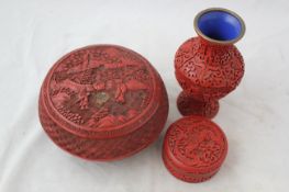 Three items of Chinese cinnabar lacquer, late 19th / mid 20th century, the first a compressed