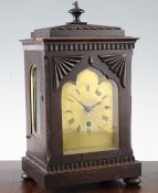 A Regency mahogany mantel timepiece, with fluted case and Gothic arched brass dial, single fusee