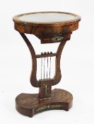 A Biedermier oval mahogany bijouterie table, with hinged glass top, with a single drawer, on lyre