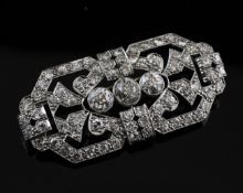 A 1940`s/1950`s Art Deco style white gold and diamond set brooch, of pierced shaped rectangular