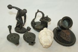 Six souvenirs of the Grand Tour, c.1820-40 including a bronze figure of a discus thrower, 5.1in., a