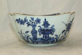 A Chinese blue and white square bowl, Daoguang period, painted with peonies, rockwork and scholars