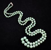 A single strand graduated jadeite bead necklace, with 9ct gold rectangular clasp, 30in.