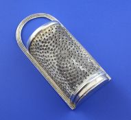 A George IV nutmeg grater by Charles Rawlings, of semi circular form, with engraved armorial,