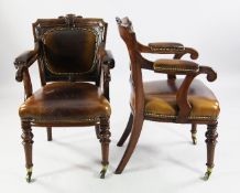 A pair of Victorian mahogany brass studded leather open armchairs, with stamp marks for Hewetson &