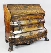 An 18th century Dutch marquetry walnut bombe shaped bureau, with fall front over three long
