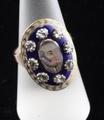 A 19th century gold, two colour enamel and rose cut diamond mourning ring with inset portrait panel