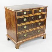 A William and Mary oyster veneered chest, of two short and three long crossbanded drawers with