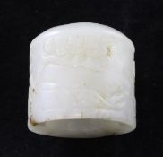 A Chinese white and brown jade archer`s ring, carved in low relief with lingzhi fungus, rockwork