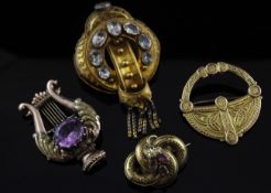 A late Victorian 9ct gold brooch with Celtic decoration, 1.25in, together with three other