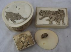 Eight Japanese ivory boxes, early 20th century, each engraved or carved in relief with animals