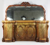 A large Victorian mahogany inverted breakfront mirror back sideboard, the mirror back with eagle