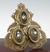 A Victorian pierced brass and pietra dura mounted triple easel photograph frame, 11.5in.