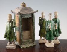 Four pottery tomb figures and a similar model of a shrine, Tang dynasty, two of the figures