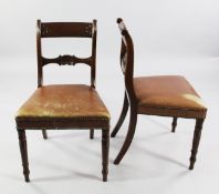A set of six Regency mahogany dining chairs, with shell carved spar backs, over-stuffed seats and