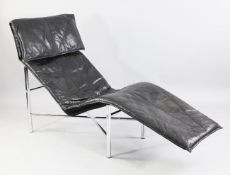 Tord Bjorklund. A 1970`s black leather and chrome lounger or day bed, 5ft