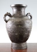 A large Chinese bronze vase, Ming dynasty, of baluster form, cast in low relief with a band of