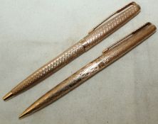 A 1970`s 9ct gold Parker ballpoint pen and a 1960`s 9ct gold Parker pencil, both with engine turned