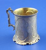 A Victorian silver christening mug by The Barnards, of cylindrical form, engraved with rural scenes