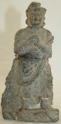 A Gandharan schist figure from Taxila, c. 320 BC, the standing figure wearing flowing robes, 18cm,