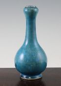 A Chinese turquoise glazed garlic neck bottle vase, 18th / 19th century, with areas of light