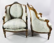 A pair of Louis XVI style stained beech and gilt bronze mounted armchairs, with oval pad backs and