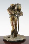 Alaxandre Clerget (French, 1856-1931). An Art Nouveau figural bronze candlestick, modelled as a