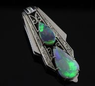 An Art Deco 9ct gold and white opal clip, with pierced setting and set with one white opal and one