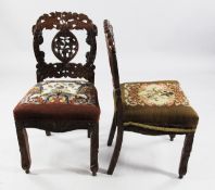 A set of six late 19th / early 20th century Indian rosewood chairs, heavily carved allover with