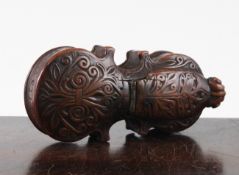 A late 18th century French carved walnut snuff box, modelled as a cello, with scrolled decoration,