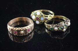 Three late Victorian gold and gem set dress rings, including white opal and garnet.