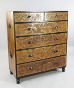 An early 20th century Anglo Chinese camphorwood chest, of two short and four long drawers, carved