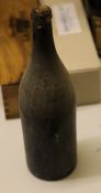 Twelve over-size unlabelled bottles of unidentified contents, believed rum, c. 1900, driven corks,