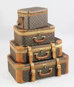 Three graduated Louis Vuitton suitcases, largest 2ft 3.5in. and a matching vanity case