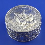 An early 20th century Hanau silver circular box with hinge lid, by Berthold Muller, embossed with