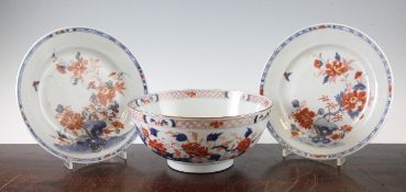 A Chinese Imari bowl and two similar plates, Qianlong period, each painted with flowers and