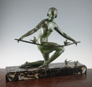 G. Arisse. A 1930s green patinated metal group of a lady with song birds, mounted on a signed