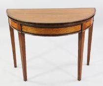 A George III satinwood and rosewood crossbanded demi lune folding card table, on square section