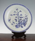 A Chinese blue and white dish, Qianlong period, painted to the centre with cranes, peonies, pine