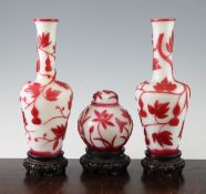 A pair of Chinese Beijing glass bottle vases and a similar jar and cover, late 19th / early 20th
