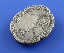An early Victorian silver vinaigrette, of shaped oval form, the lid engraved with river scene with