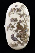A 19th century oval Japanese ivory and shibayama etui case, the lid decorated with birds among