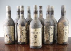 Twelve bottles of Warre`s vintage port 1977, heavily cellar-soiled bottles with remains of