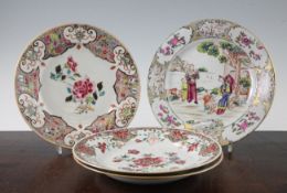 Four Chinese famille rose plates, Qianlong period, comprising a pair painted with peonies and other